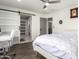 Bedroom with sliding barn door to bathroom at 850 E Del Rio St, Chandler, AZ 85225