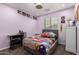 Bright bedroom with a double bed and a study area at 850 E Del Rio St, Chandler, AZ 85225