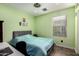 Light green bedroom with double bed and window at 850 E Del Rio St, Chandler, AZ 85225