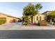 Two-story house with a three-car garage and palm trees at 850 E Del Rio St, Chandler, AZ 85225