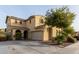 Two-story house with a three-car garage and landscaping at 850 E Del Rio St, Chandler, AZ 85225