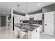 Modern kitchen with granite island and white cabinets at 850 E Del Rio St, Chandler, AZ 85225