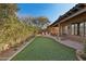 Artificial turf backyard with patio seating at 8534 E Angel Spirit Dr, Scottsdale, AZ 85255