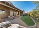 Spacious backyard with artificial turf and paved patio area at 8534 E Angel Spirit Dr, Scottsdale, AZ 85255