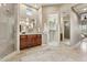 Bathroom with walk-in shower, double vanity, and access to a large closet at 8534 E Angel Spirit Dr, Scottsdale, AZ 85255