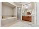 Spa-like bathroom with soaking tub, walk-in shower, and modern vanity at 8534 E Angel Spirit Dr, Scottsdale, AZ 85255