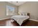 Spacious bedroom featuring a queen bed, wood floors and large window at 8534 E Angel Spirit Dr, Scottsdale, AZ 85255