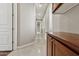 Bright hallway with wood cabinets and tile floors at 8534 E Angel Spirit Dr, Scottsdale, AZ 85255