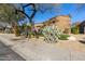 Front view of house with mature trees at 8534 E Angel Spirit Dr, Scottsdale, AZ 85255