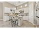 Bright kitchen with white cabinets, stainless steel appliances, and granite countertops at 8534 E Angel Spirit Dr, Scottsdale, AZ 85255