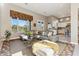 Relaxing living room featuring a sectional sofa, coffee table, and kitchen view at 8534 E Angel Spirit Dr, Scottsdale, AZ 85255