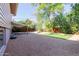 Spacious backyard with gravel, artificial turf, and covered patio at 8614 E Valley View Rd, Scottsdale, AZ 85250