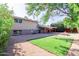 Artificial turf, fire pit, and patio in this backyard at 8614 E Valley View Rd, Scottsdale, AZ 85250