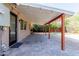 Covered patio with brick pavers, string lights, and access to grassy backyard at 8614 E Valley View Rd, Scottsdale, AZ 85250