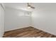 Bright bedroom with wood-look floors and ceiling fan at 8614 E Valley View Rd, Scottsdale, AZ 85250