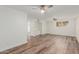 Well-lit bedroom with wood-look floors and ceiling fan at 8614 E Valley View Rd, Scottsdale, AZ 85250