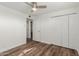 Bright bedroom with wood-look floors and ceiling fan at 8614 E Valley View Rd, Scottsdale, AZ 85250