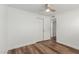 Simple bedroom with wood-look floors and ceiling fan at 8614 E Valley View Rd, Scottsdale, AZ 85250