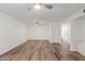 Bright bedroom featuring wood-look floors and ceiling fans at 8614 E Valley View Rd, Scottsdale, AZ 85250