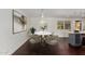 Bright dining area with a round marble table, modern lighting fixture, and a view to the outside at 8614 E Valley View Rd, Scottsdale, AZ 85250