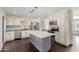 Modern kitchen with white cabinets, quartz countertops, and an island at 8614 E Valley View Rd, Scottsdale, AZ 85250