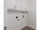 Laundry room with built-in cabinets and utility hookups at 8614 E Valley View Rd, Scottsdale, AZ 85250