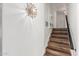 Modern staircase with wood-look flooring and sleek handrail at 8614 E Valley View Rd, Scottsdale, AZ 85250