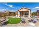 Artificial turf and fire pit highlight this backyard at 8725 E Indigo St, Mesa, AZ 85207