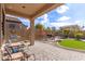 Landscaped backyard with patio, fire pit, and grill at 8725 E Indigo St, Mesa, AZ 85207