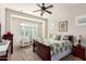 Serene bedroom with leafy bedding and window seating area at 8725 E Indigo St, Mesa, AZ 85207