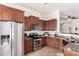 Kitchen boasts stainless steel appliances and granite counters at 8725 E Indigo St, Mesa, AZ 85207