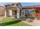 Backyard with covered patio and lush landscaping at 9127 W Kimberly Way, Peoria, AZ 85382