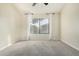 Spacious bedroom featuring a large window and neutral carpeting at 9127 W Kimberly Way, Peoria, AZ 85382