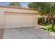 Two-car garage with an attached walkway to the home's entrance at 9127 W Kimberly Way, Peoria, AZ 85382