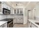 Updated kitchen featuring granite countertops and stylish cabinetry at 9127 W Kimberly Way, Peoria, AZ 85382