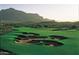 Aerial view of golf course with sand traps and mountain backdrop at 9505 E Superstition Mountain Dr, Gold Canyon, AZ 85118