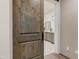 Bathroom with a barn door entry and a view of double vanity at 9505 E Superstition Mountain Dr, Gold Canyon, AZ 85118