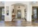 Elegant entryway with wood floors, chandelier, and decorative console table at 9505 E Superstition Mountain Dr, Gold Canyon, AZ 85118