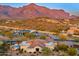 Luxury home in desert with a pool, patio, and picturesque mountain backdrop at 9505 E Superstition Mountain Dr, Gold Canyon, AZ 85118