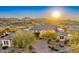 Desert home showcasing xeriscaped front yard, architectural details, and picturesque desert views at 9505 E Superstition Mountain Dr, Gold Canyon, AZ 85118