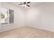 Spacious bedroom with tile floors and large window with shutters at 9745 E Natal Ave, Mesa, AZ 85209