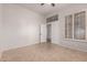 Bright bedroom with tile floors, ceiling fan, and plantation shutters at 9745 E Natal Ave, Mesa, AZ 85209