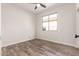 Well-lit bedroom featuring wood-look floors at 9745 E Natal Ave, Mesa, AZ 85209