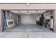 Spacious two-car garage with epoxy flooring at 9745 E Natal Ave, Mesa, AZ 85209