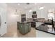 Modern kitchen featuring a large island, granite countertops, and white cabinets at 9745 E Natal Ave, Mesa, AZ 85209