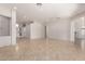 Open living room with tile floors, multiple entry points, and neutral walls at 9745 E Natal Ave, Mesa, AZ 85209