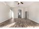 Main bedroom with wood-look floors and access to the bathroom at 9745 E Natal Ave, Mesa, AZ 85209