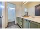 Bathroom with double vanity, large mirror, and shower at 9778 E Barley Rd, Florence, AZ 85132