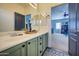 Double vanity bathroom with view of another room at 9778 E Barley Rd, Florence, AZ 85132