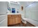 Clean bathroom with a shower/tub combo, wood vanity, and tiled floor at 9778 E Barley Rd, Florence, AZ 85132